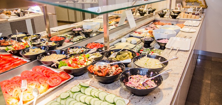 Cold and warm dishes on the breakfast buffet